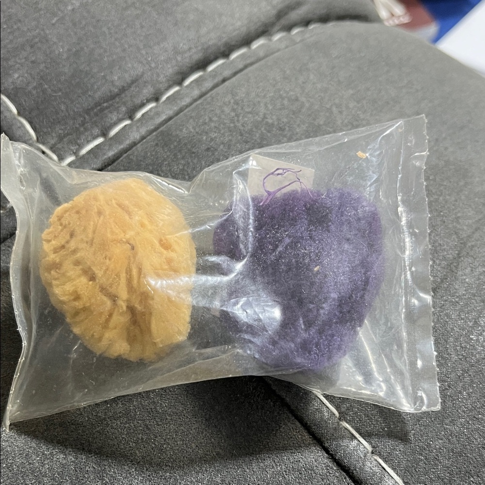 Avon Skincare facial sponges in Purple and Tan